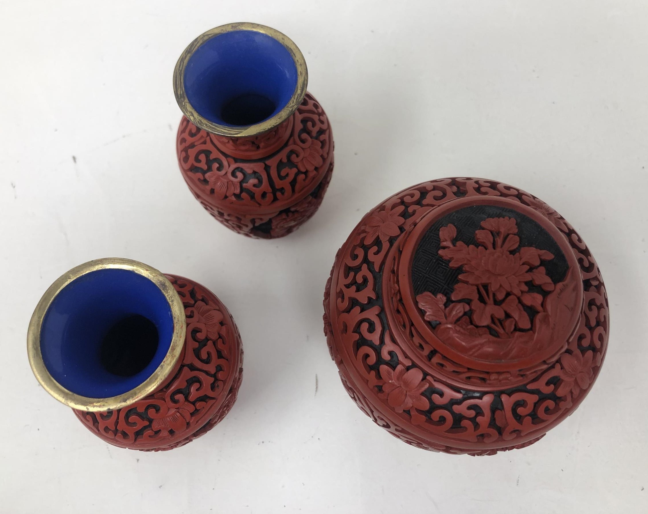 A pair of Chinese cinnabar lacquer vases, 10 cm high, and a matching jar and cover, 10.5 cm high (3) - Image 2 of 4