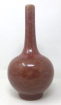 A Chinese red ground bottle vase, six character mark to base, 23 cm high No visible chips cracks