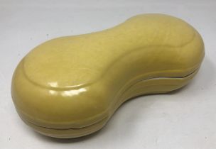 A Chinese yellow glazed shaped box and cover, character mark to base, 26 cm wide