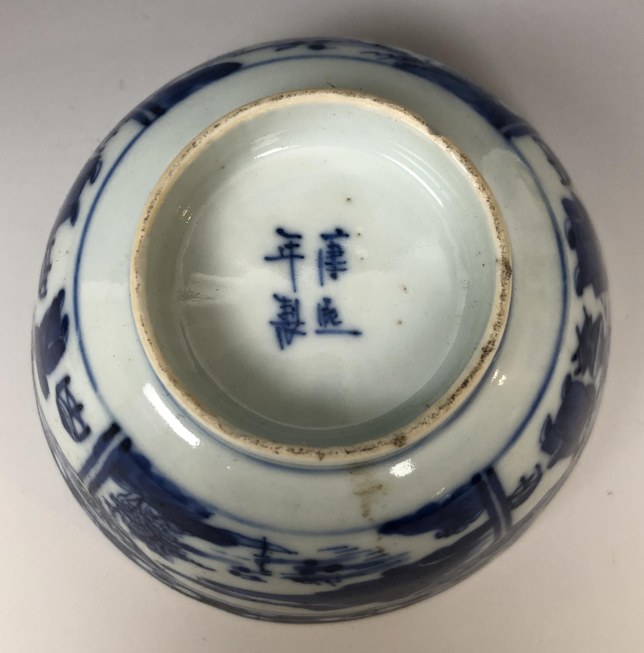 A pair of Chinese porcelain bowls, decorated panels of figures and landscapes in underglaze blue, - Image 6 of 7