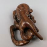 A carved wooden netsuke, in the form of an octopus, 5 cm wide