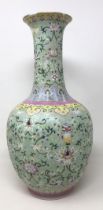 A Chinese vase, decorated flowers in enamel colours, character mark to base, 36 cm high Gilt is