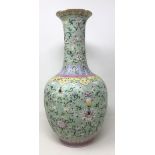 A Chinese vase, decorated flowers in enamel colours, character mark to base, 36 cm high Gilt is