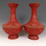 A pair of Chinese cinnabar lacquer vases, 27 cm high Provenance: Purchased from the Sotheby's