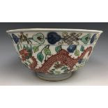 A Chinese porcelain bowl, the interior decorated a dragon, the exterior dragons, phoenix and other