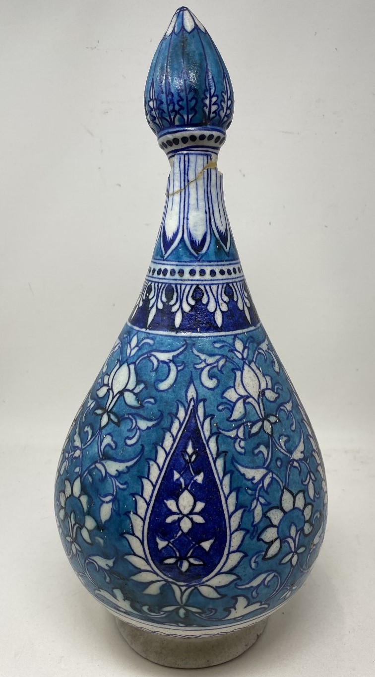 An Isnik blue ground vase and cover, 37 cm high with large losses and restored