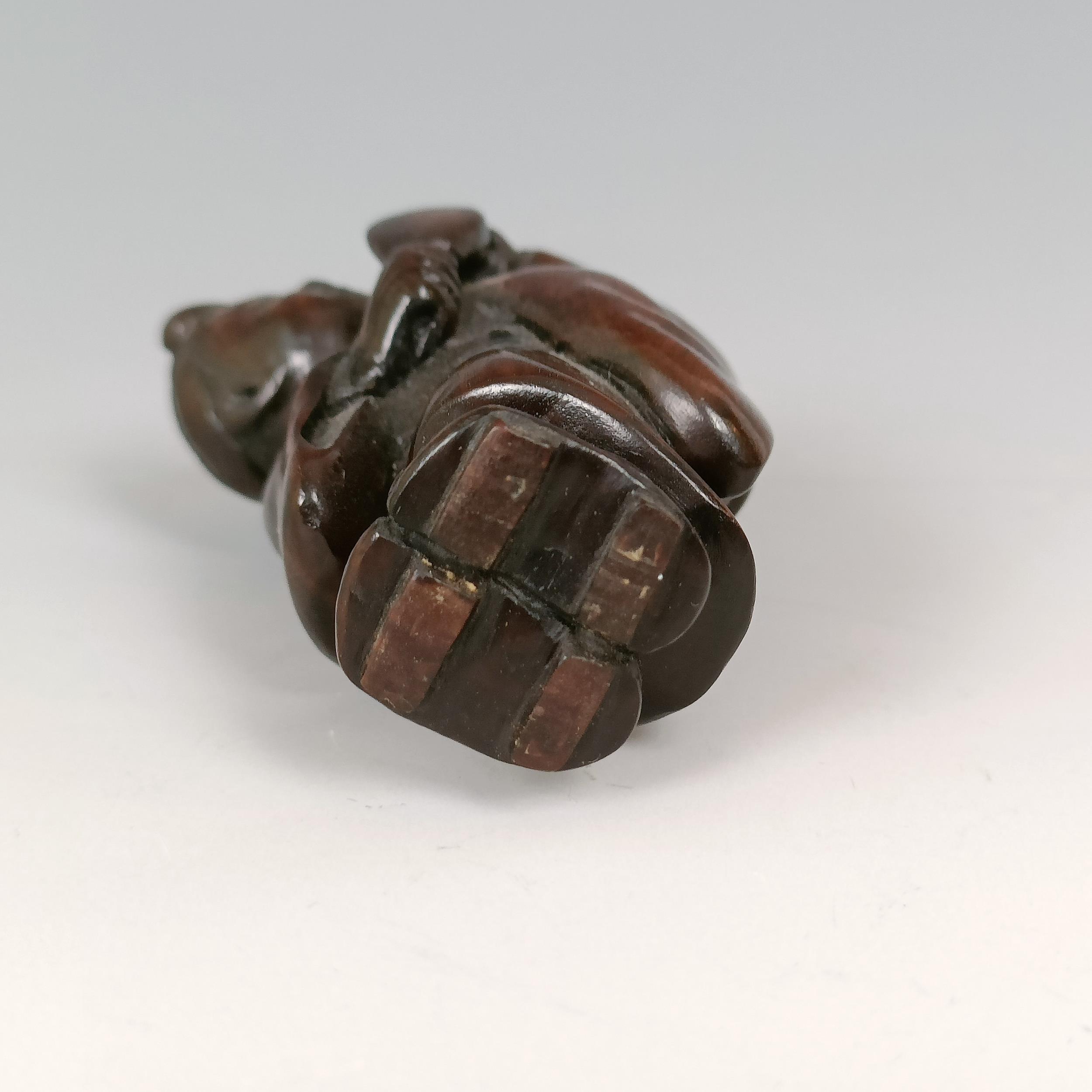 A carved wooden netsuke, in the form of mother and child, signed, 5 cm - Image 4 of 6