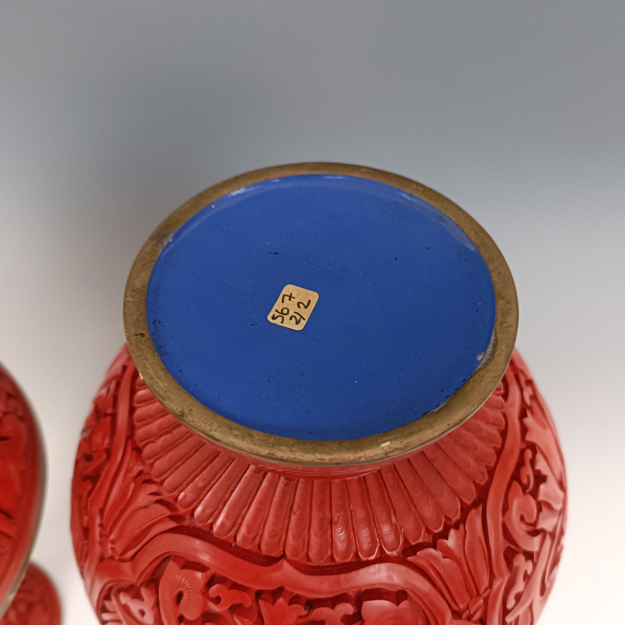 A pair of Chinese cinnabar lacquer vases, 27 cm high Provenance: Purchased from the Sotheby's - Image 6 of 9