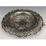 A Chinese silver coloured metal dish, embossed and pierced flowers and foliage, 13 cm diameter 3.1