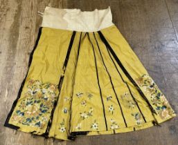 A Chinese yellow ground underskirt, decorated flowers, and another (2) Condition poor, various tears