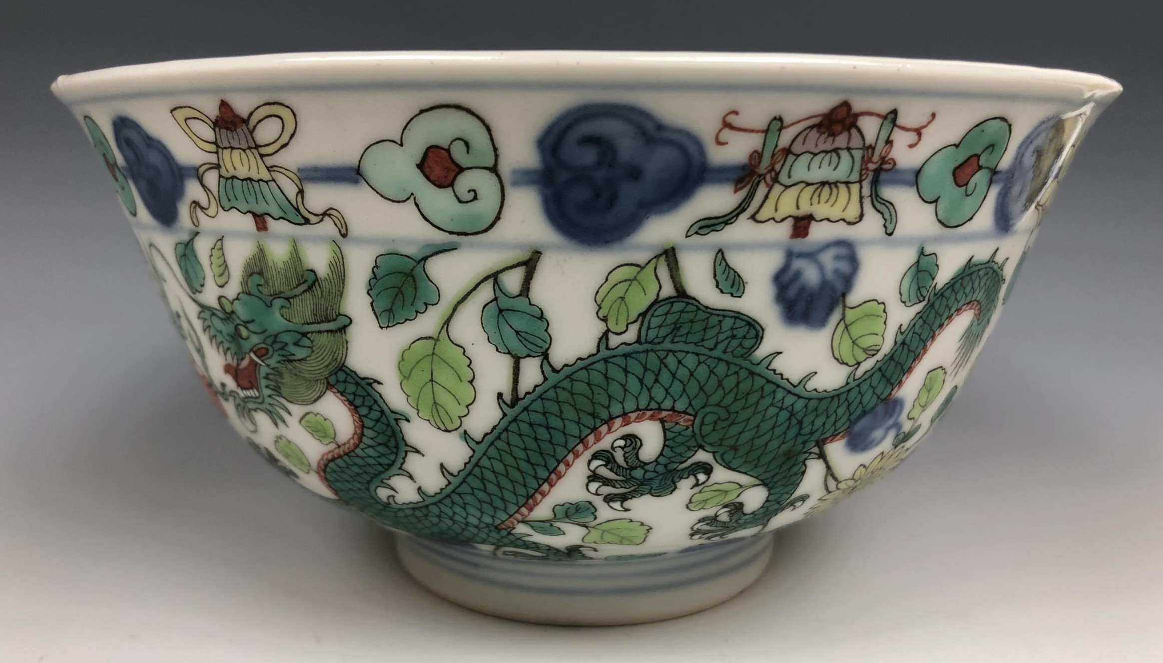 A Chinese porcelain bowl, the interior decorated a dragon, the exterior dragons, phoenix and other - Image 2 of 4