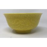 A Chinese yellow ground dragon bowl, six character mark to base, 16 cm diameter