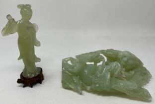 A Chinese carved greenstone figure of a dragon, 20 cm high, and another of a lady, 16 cm high (2)