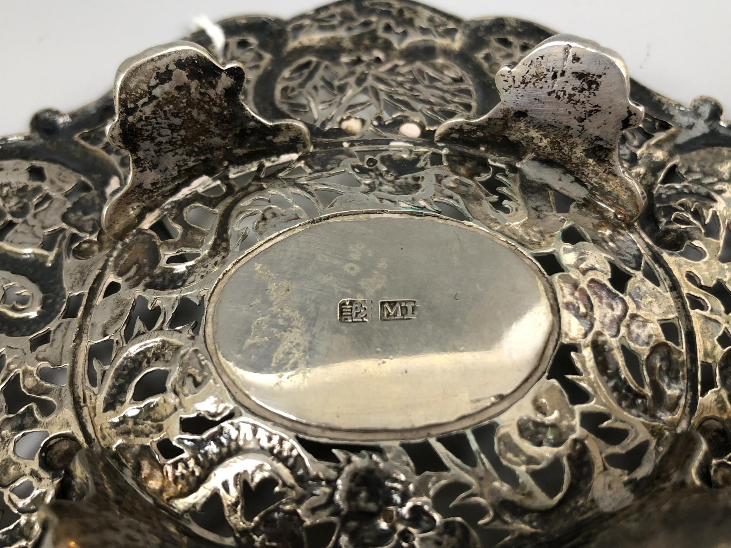A Chinese silver coloured metal dish, embossed and pierced prunus and dragons, 15.5 cm wide 3.1 ozt - Image 4 of 4
