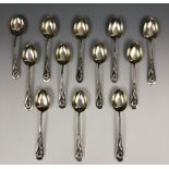 A set of twelve Chinese silver coloured metal spoons, the handles applied dragons, Wang Hing 5.0