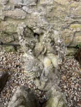 A composite stone garden statue, of a loving couple, 88 cm