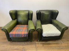 A pair of green leather armchairs, with later seats (2)