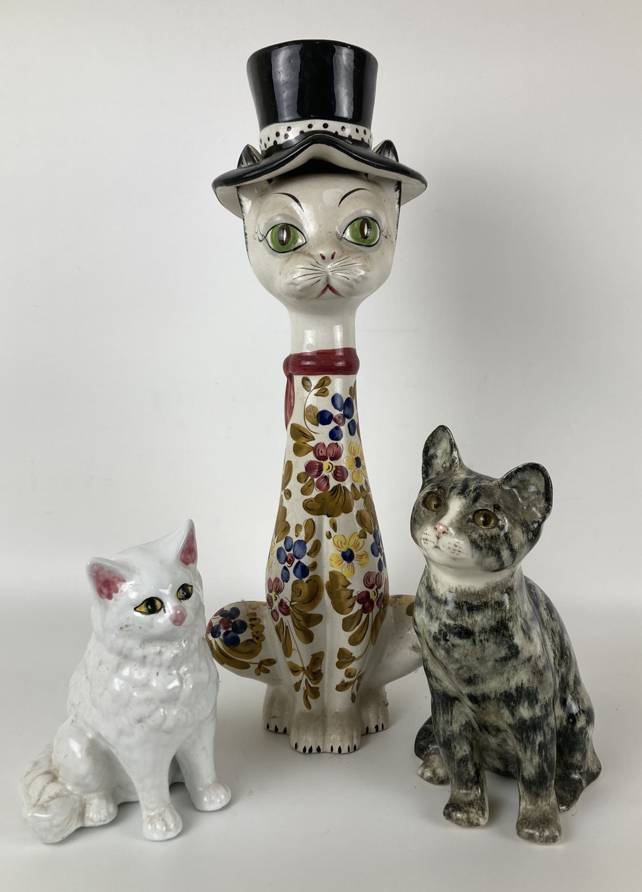 A Winstanley cat, 23 cm high, and two other cat figures (3)