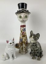 A Winstanley cat, 23 cm high, and two other cat figures (3)