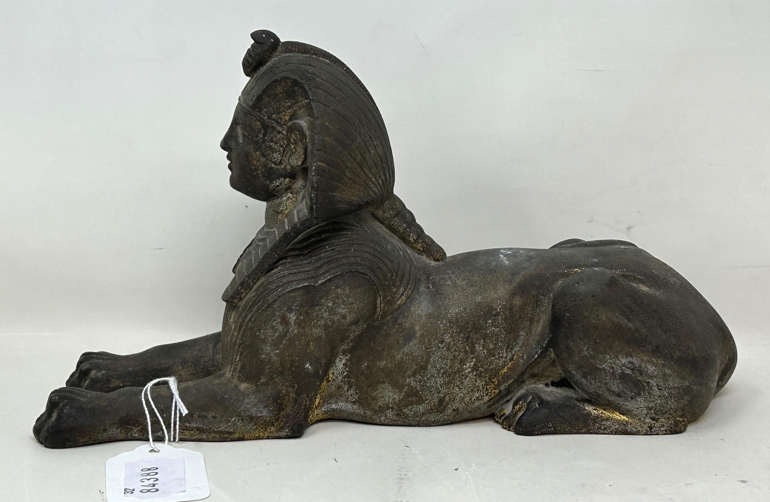 An Egyptian style Sphinx, 25 cm wide, and a figure of a bull's head (2) - Image 5 of 6