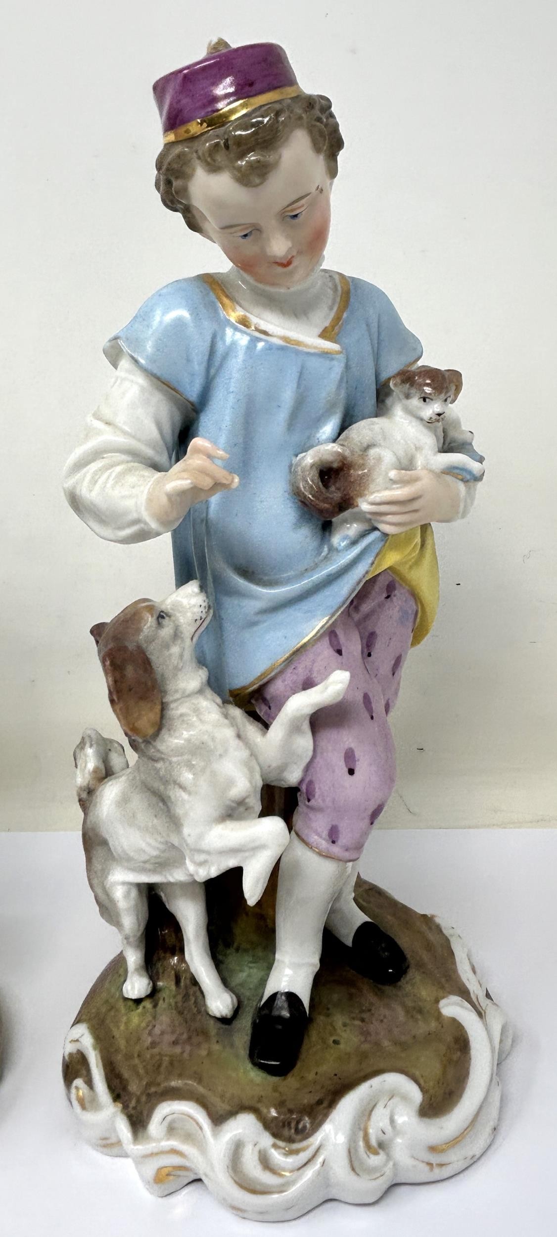 A pair of Dresden figures, of a young boy with a dog and puppy, and a young girl with a cat and - Image 3 of 5