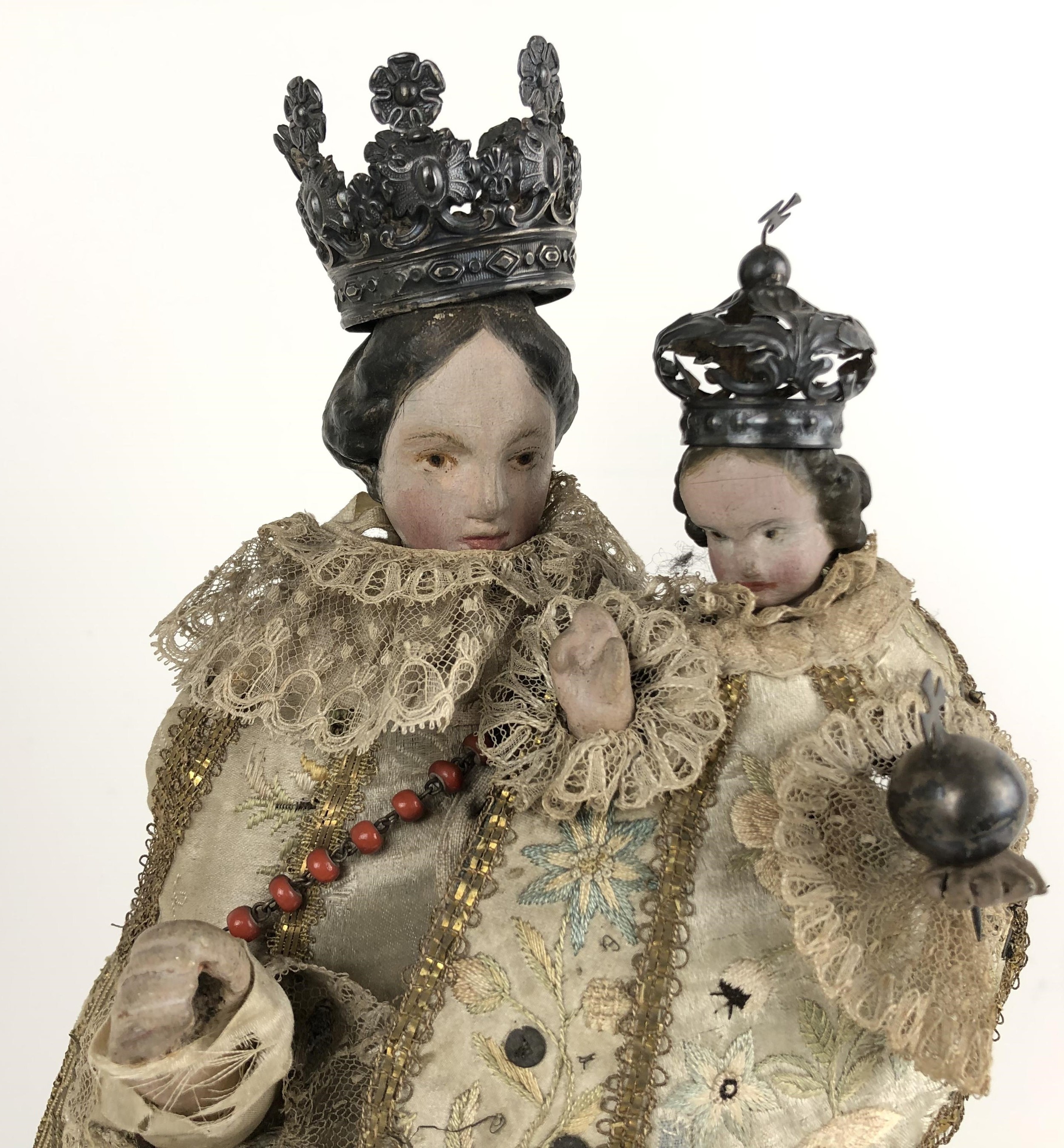 An 18th century style group of the Madonna and Child, with silver coloured metal crowns and silk - Image 2 of 4