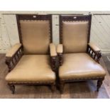 A pair of early 20th century oak framed armchairs