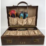 A vintage travelling shoe case, to include five pairs of ladies shoes