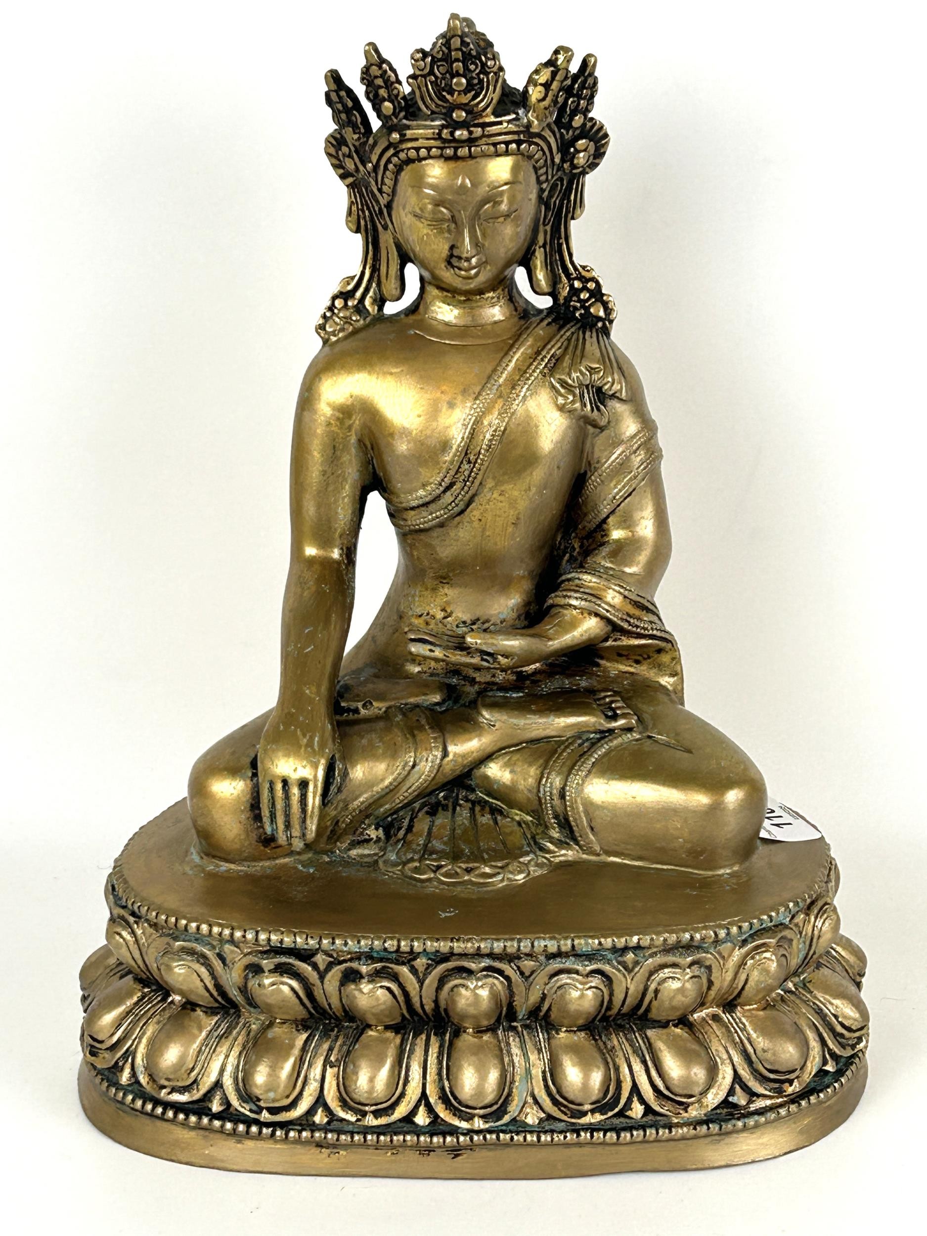 A gilt metal Buddha, 33 cm high