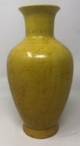 A Chinese yellow ground vase, decorated dragon, six character mark to base, 20 cm high No visible