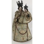An 18th century style group of the Madonna and Child, with silver coloured metal crowns and silk