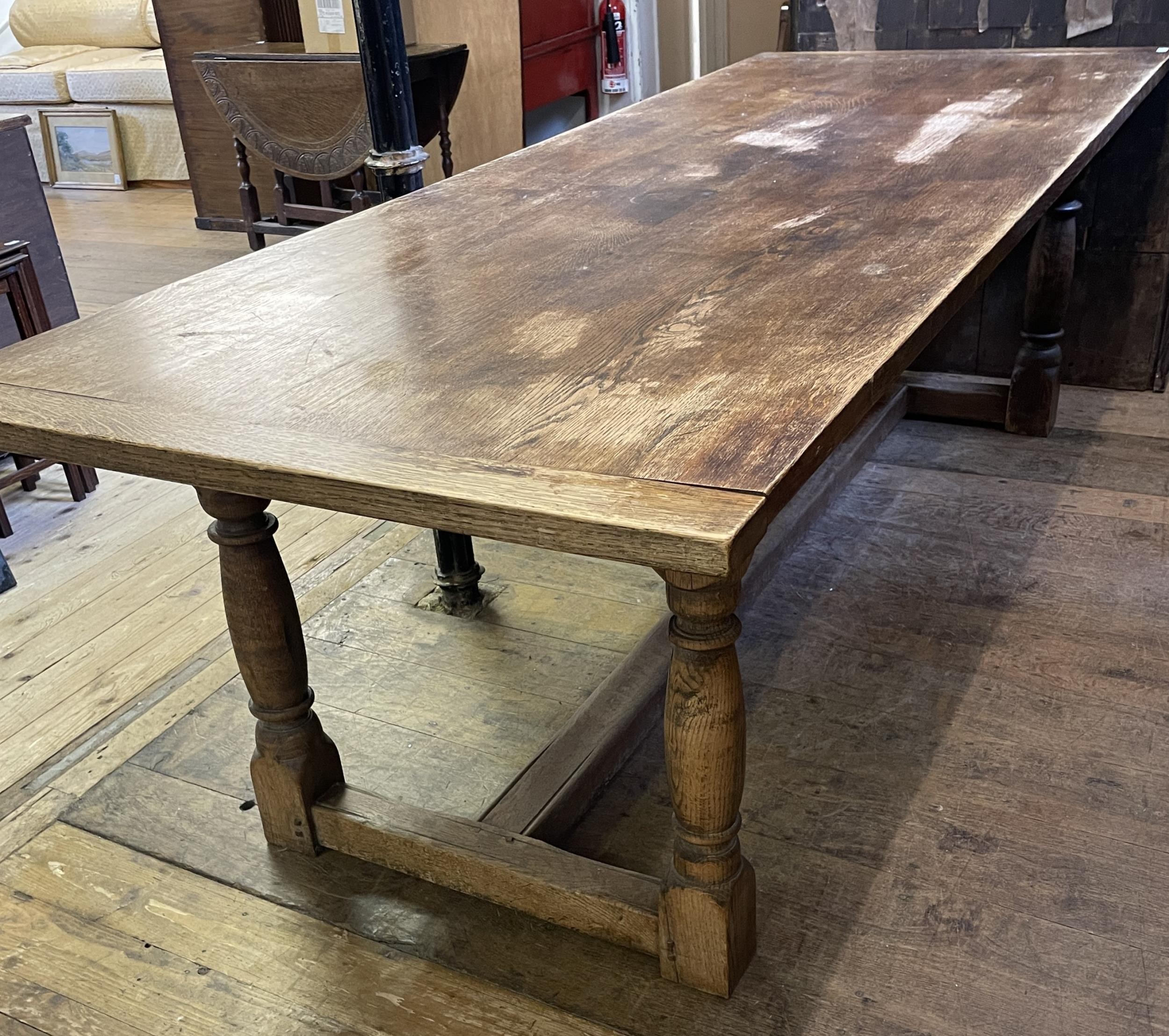 An oak  refrectory table dining table, the top 225 cm x 86 cm with, a later extension 63 cm wide