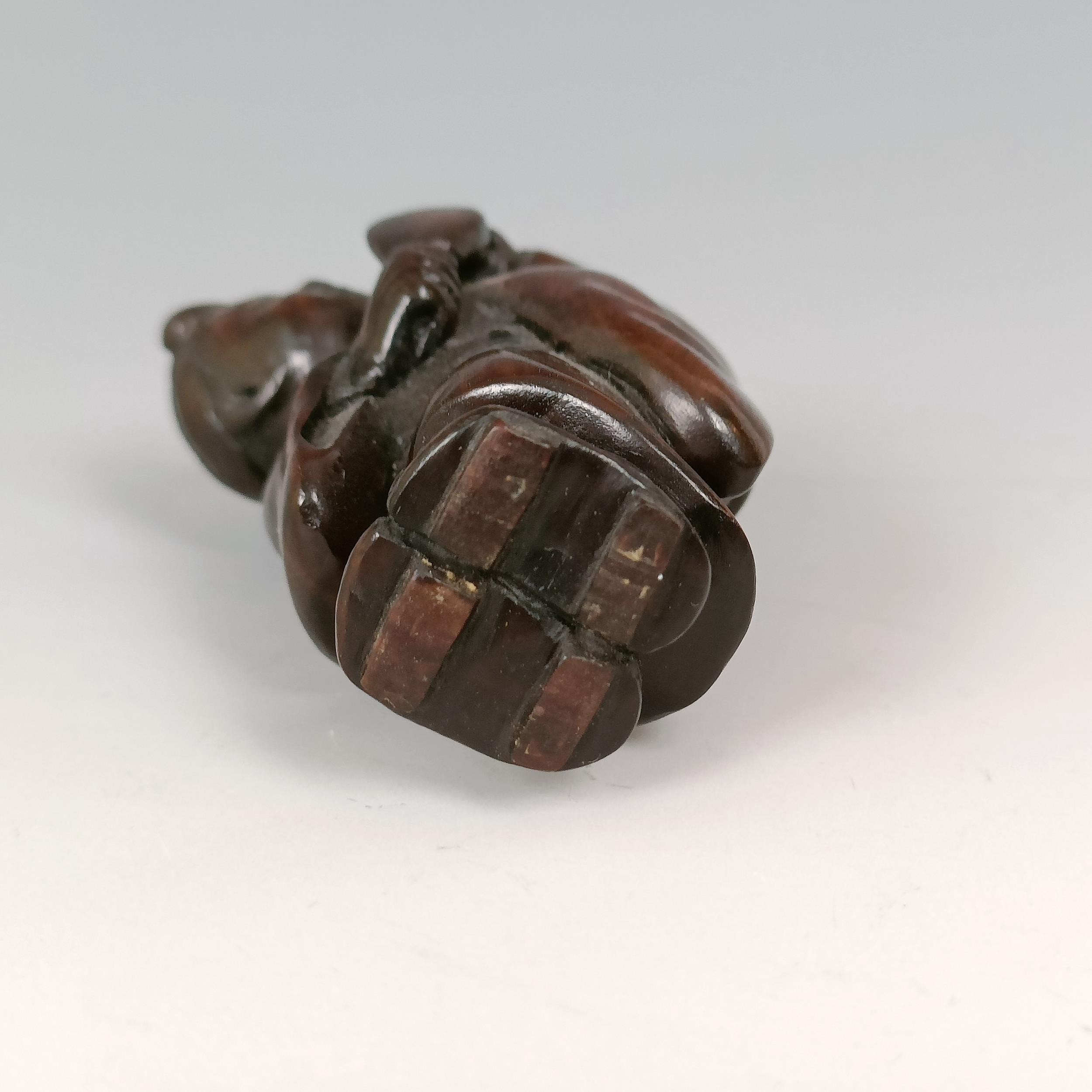 A carved wooden netsuke, in the form of an octopus, 5 cm wide and a carved wooden netsuke, in the - Image 9 of 9