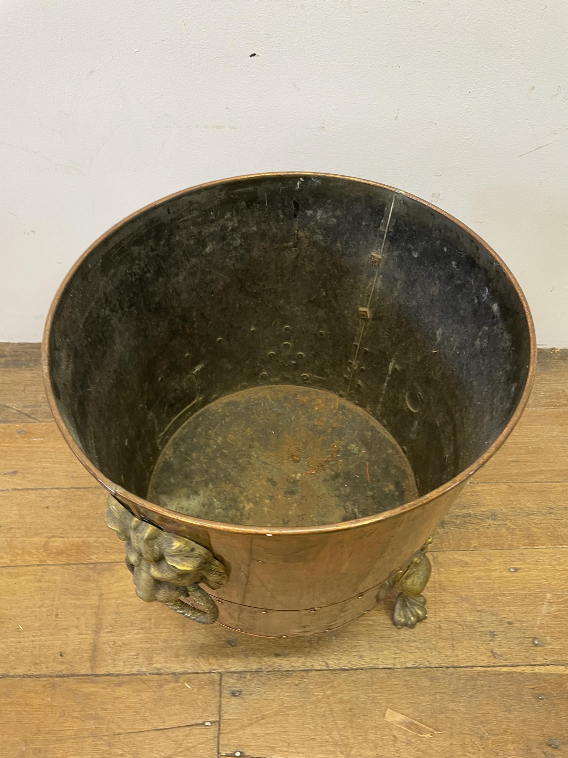 A copper and brass coal bucket, with lions head handles, 45 cm diameter, an oak table and a wine - Image 5 of 5