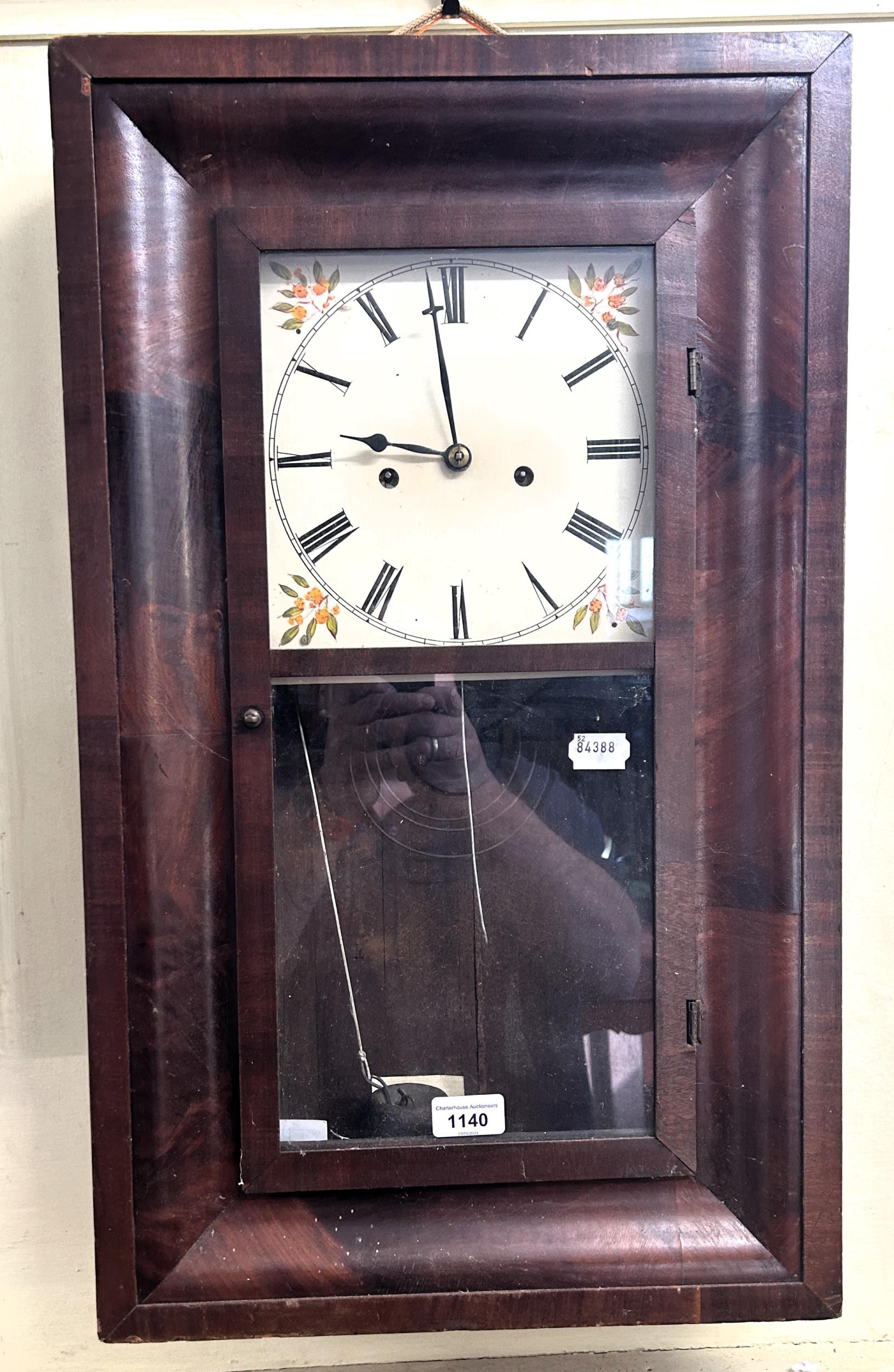 An American wall clock, 40 cm wide