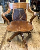 An oak adjustable desk chair