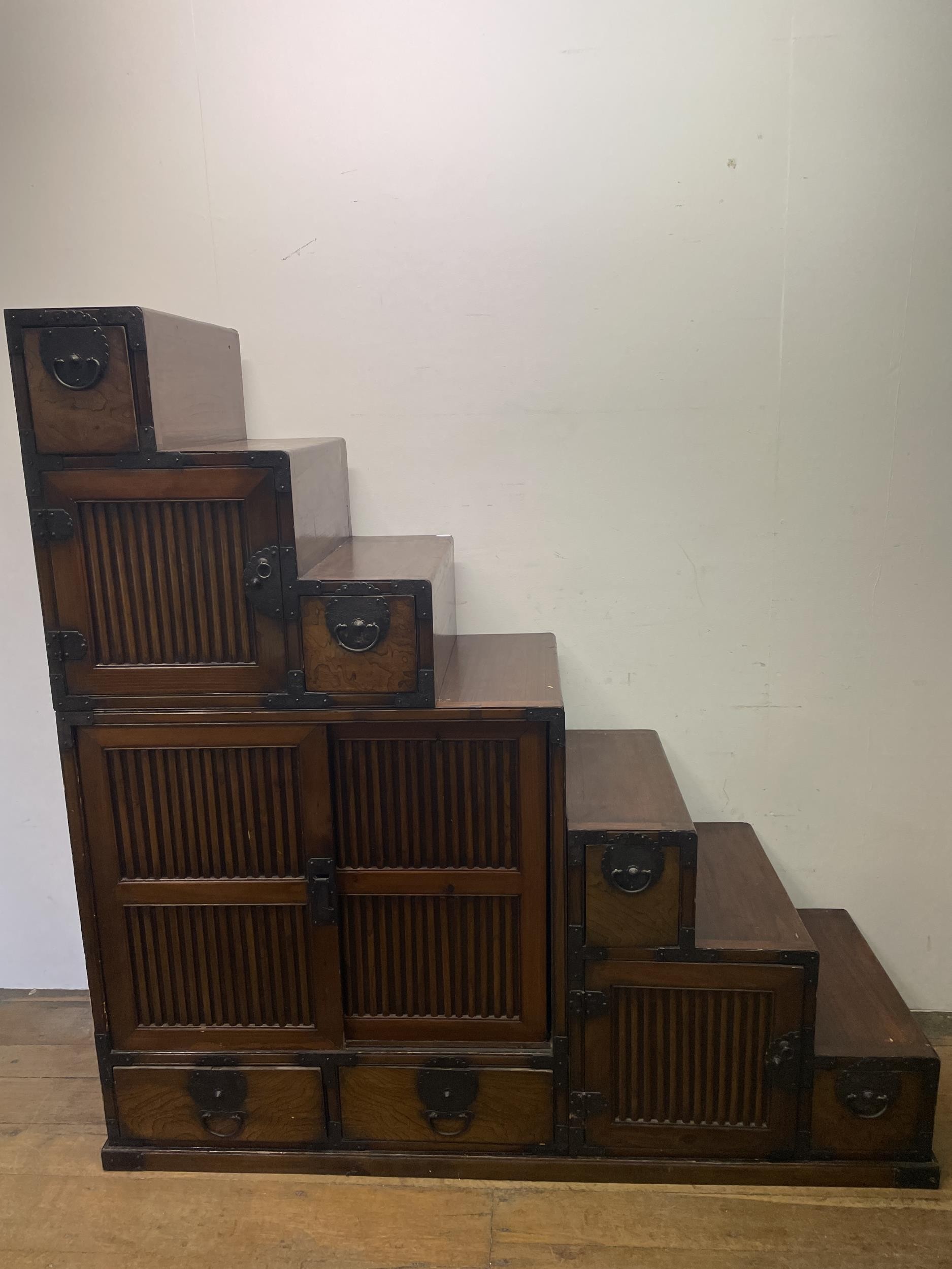 A Japanese step Tansu cabinet, 145 cm wide