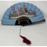 A painted wooden fan, painted a tavern scene, 29 cm, and four other fans (5)