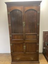 A Japanese elm and metal bound cabinet, having two cupboard doors above two further cupboard doors