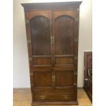 A Japanese elm and metal bound cabinet, having two cupboard doors above two further cupboard doors