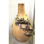 A Chinese stoneware vase, decorated dragons, 38 cm high