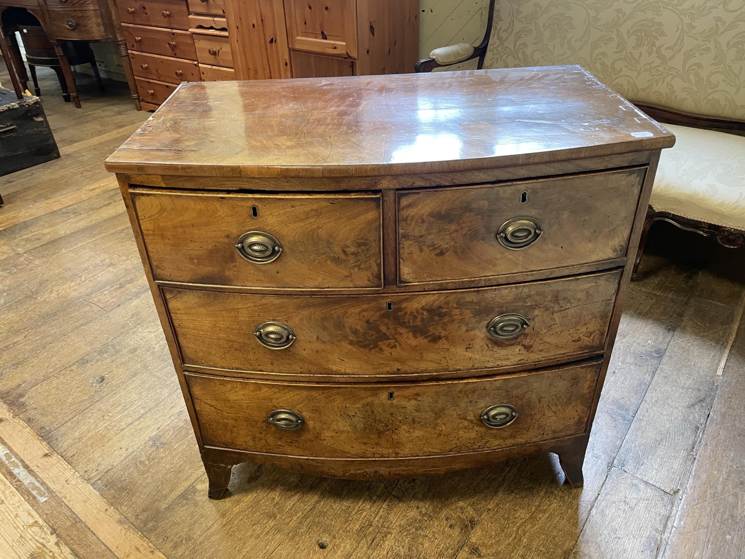 A mahogany bow front chest, having two short and three long drawers, 90 cm wide
