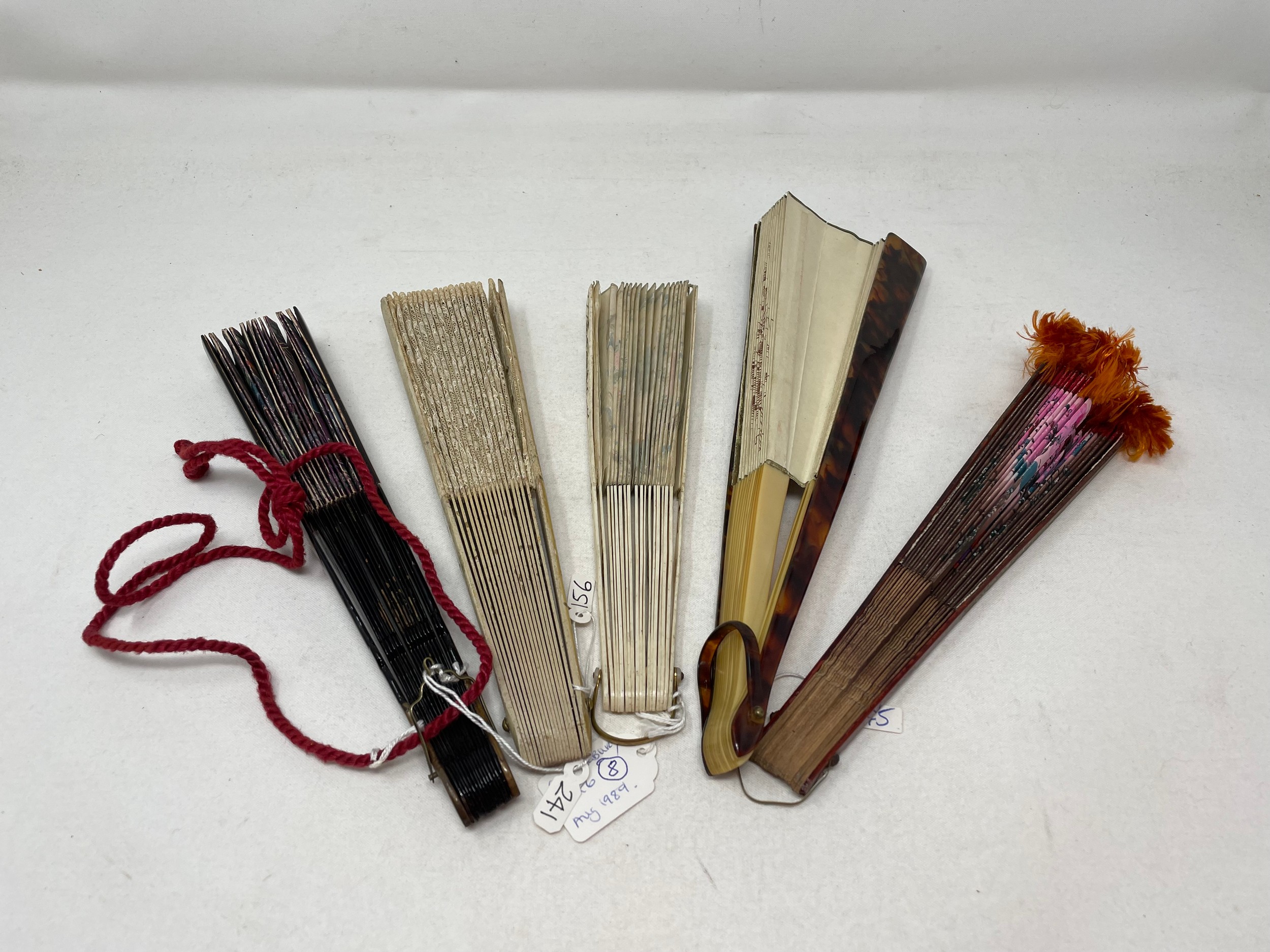 A lacquered fan, decorated figures, with the paper painted birds and flowers, 10 cm, and four