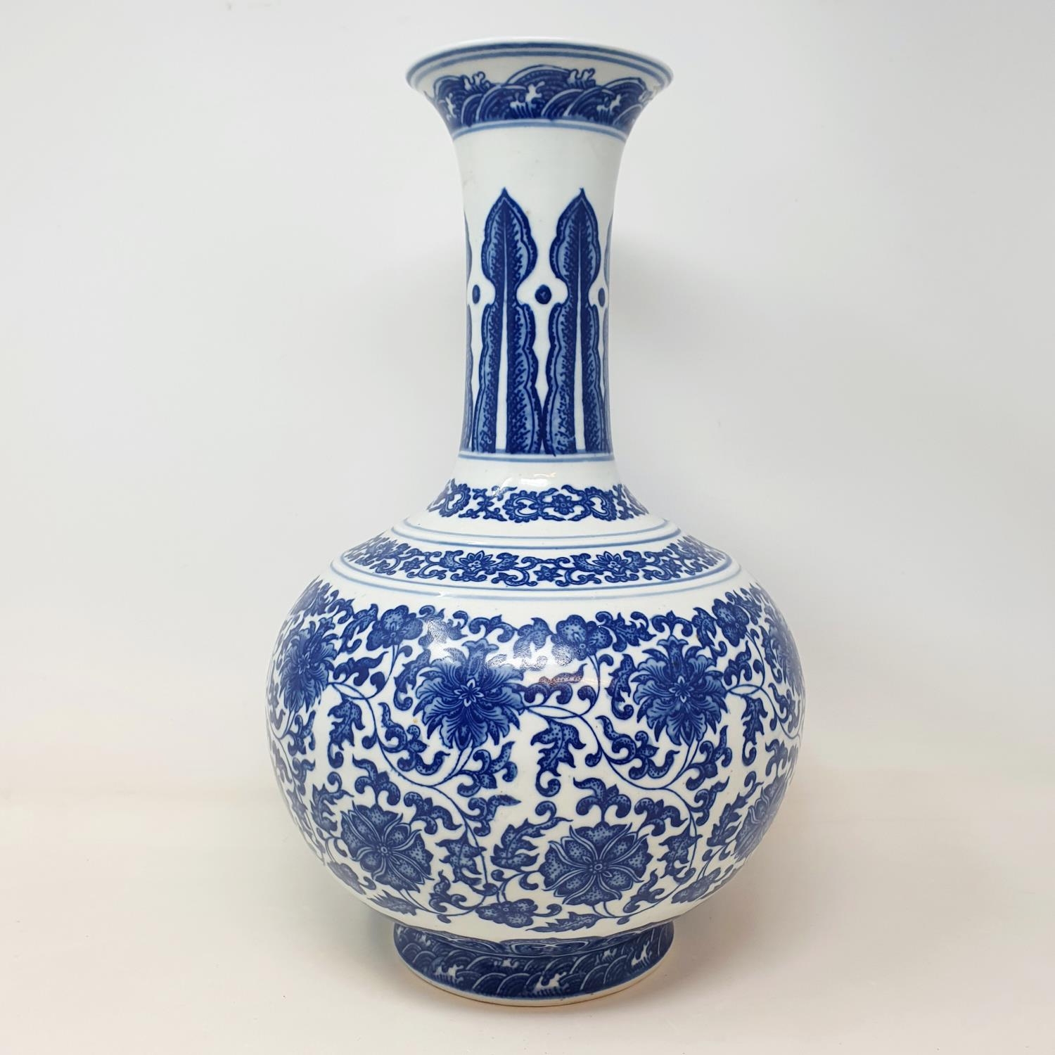 A Chinese blue and white bottle vase, decorated flowers in underglaze blue, bears a Qianlong mark, - Image 7 of 13