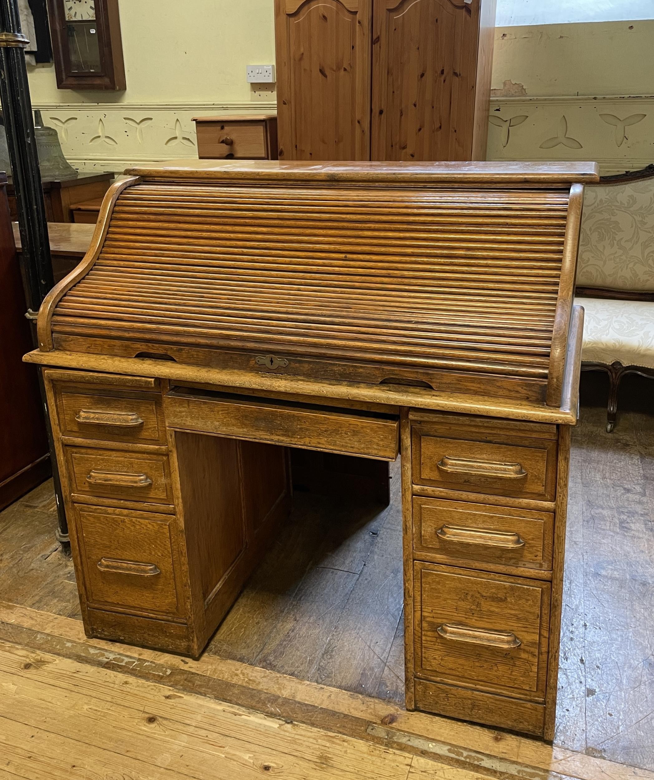 An oak tambour fronted desk, 120 cm wide