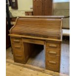 An oak tambour fronted desk, 120 cm wide