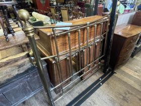 A brass double bed frame