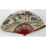 A Chinese carved fan, the paper decorated a landscape, 29 cm, a lacquered fan box, and a lacquered