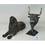 An Egyptian style Sphinx, 25 cm wide, and a figure of a bull's head (2)