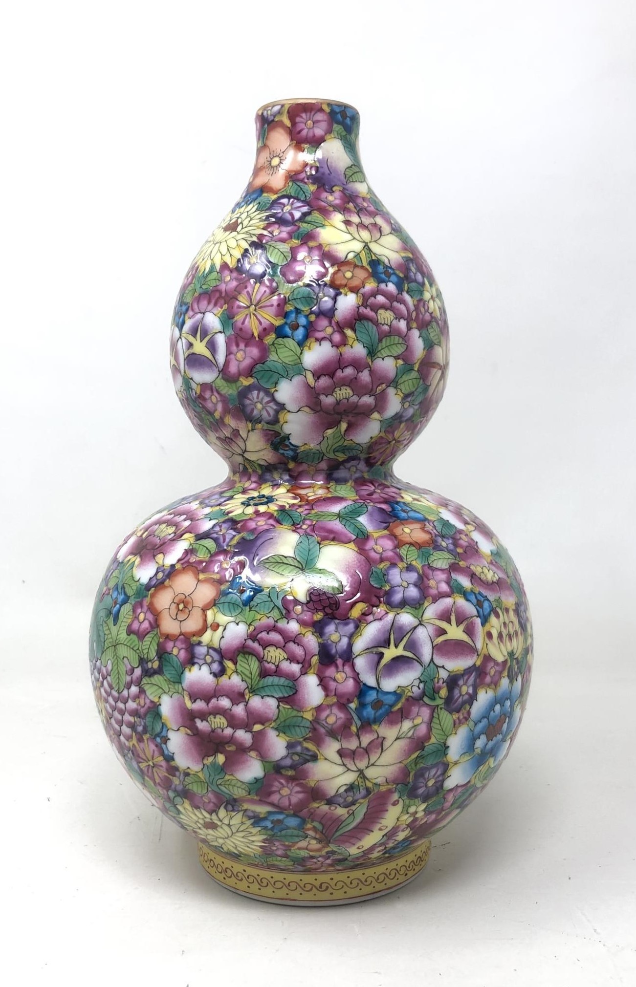 A Chinese one thousand flower double gourd vase, character mark to base, 22 cm high